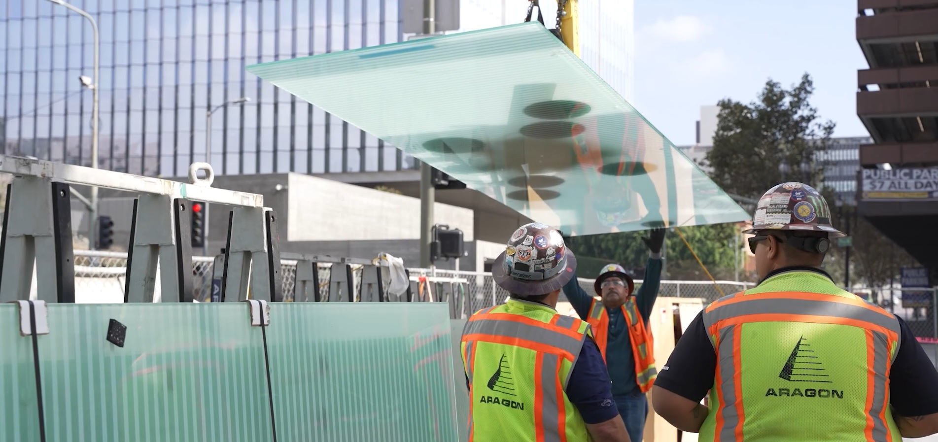 glaziers with glass handler on jobsite